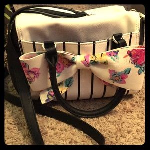 Betsy Johnson handbag with crossbody strap.